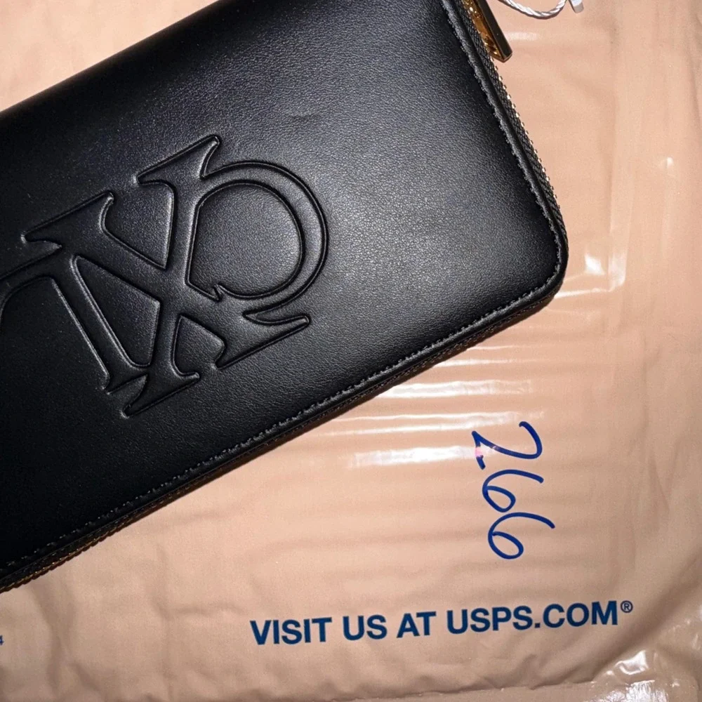 CXL by Christian Lacroix Black Embossed Logo Zip Around Wristlet Wallet NEW